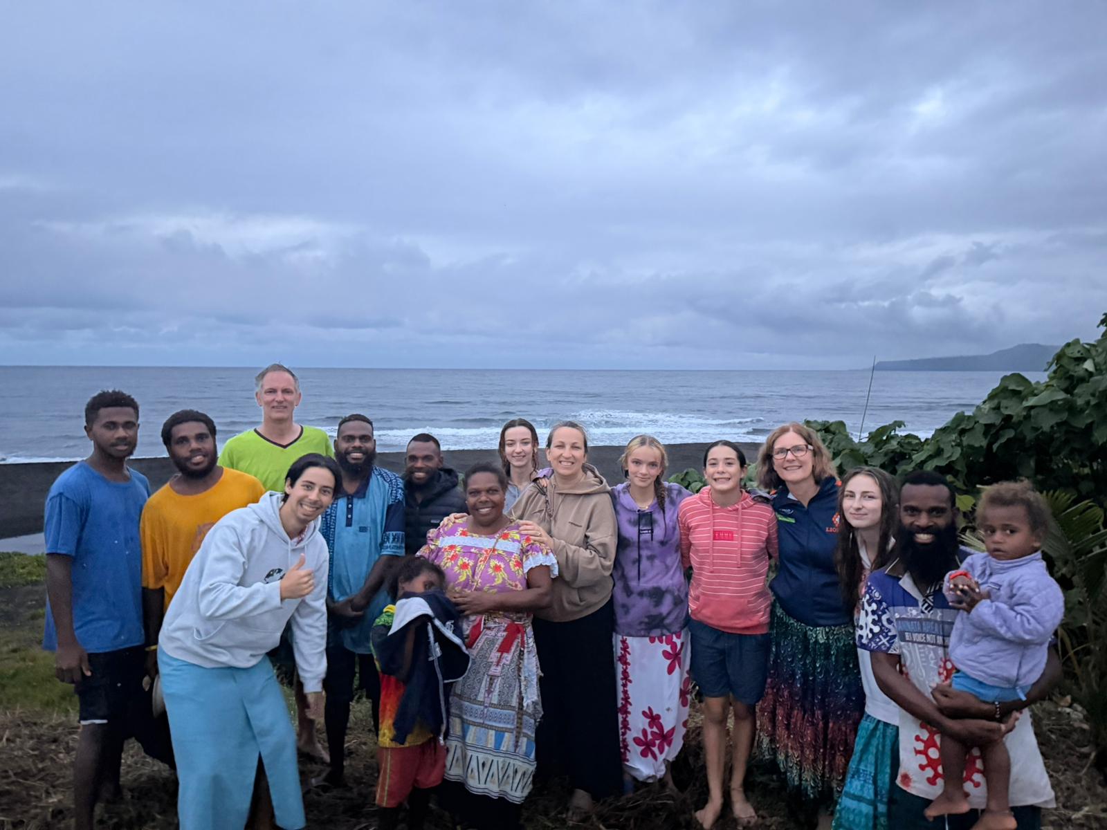 Hosts, community and guests together by the ocean