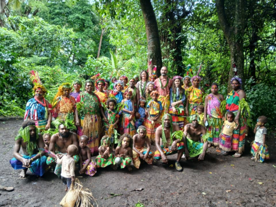 Community and guests in traditional dress