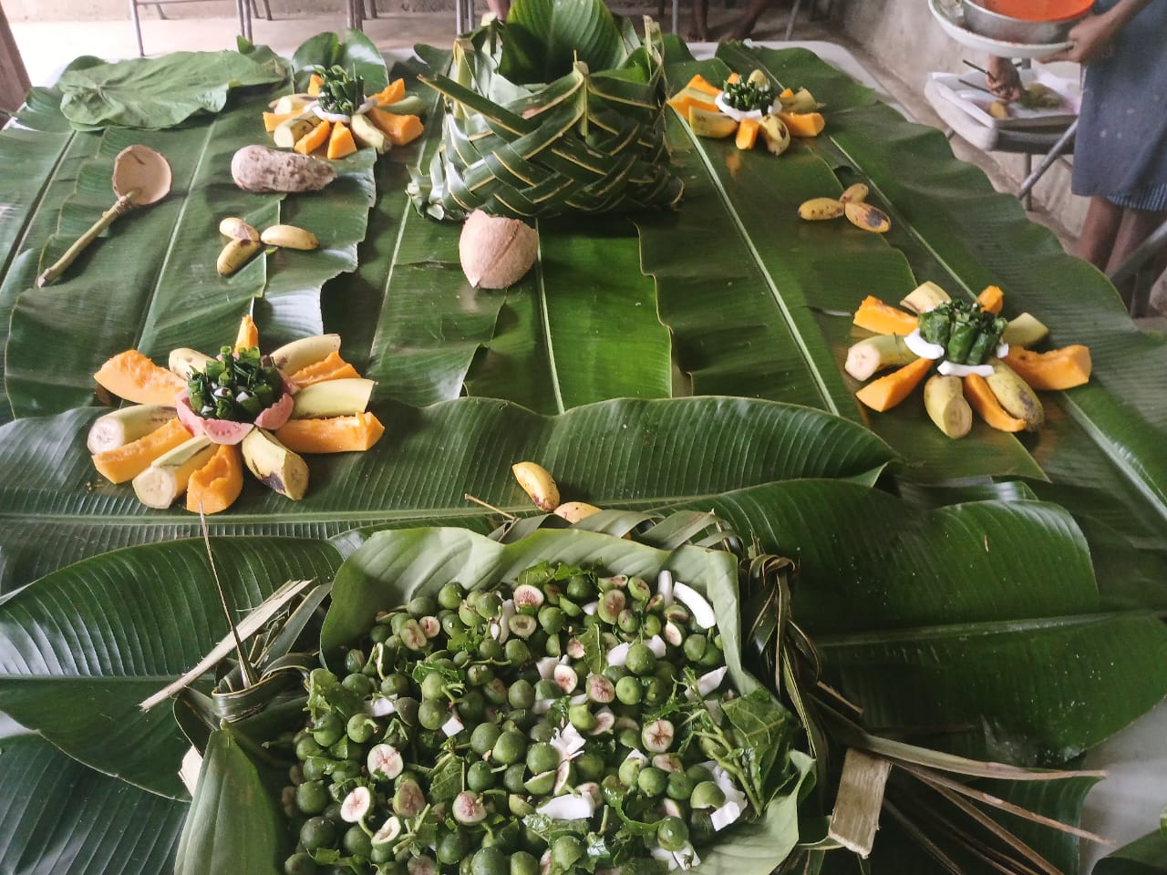 Fresh produce arranged on banana leaves